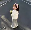 Nueva colección de primavera y otoño: top elegante y dulce de estilo coreano con orejas de conejo, perfecto para usar en capas