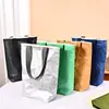 Bolsa de papel Dupont con logo personalizado, bolsa de lona vintage, bolsa de hombro de papel kraft lavable para compras, en stock