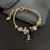 Europa y Estados Unidos transfronterizo nuevo polvo de mariposa blanco y negro pulsera colgante para mujer verano fresco pulsera de mariposa para mujer