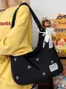 Bolso Tote de Gran Capacidad de Alta Gama para Viajes de Otoño e Invierno para Mujer 2025 Nuevo Bolso de Hombro Negro con Lazo Bordado