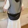 Bolso de diseñador de nicho para mujer, nuevo modelo 2026, bolso tipo empanada súper popular para llevar bajo el brazo, elegante y versátil bolso de hombro/cruzado con forma de cuerno