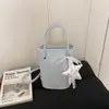 Comercio exterior diseño estilo coreano textura moda colgante vertical gran capacidad bolso colgante bolso de hombro bolso cruzado bolso cubo mujer
