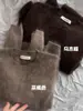 Suéter Redondo de Mohair Gris de Lujo Perezoso para Mujer en Otoño e Invierno Holgado Suave Cera Tejido Exterior Terciopelo de Visón Top