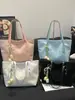 Bolso de Hombro de Lona Simple a Cuadros con Letra de Moda Transfronterizo para Mujer 2026 Nuevo de Gran Capacidad para Hombro o Axila de Moda