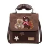 Mochila Retro Estilo Coreano de Gamuza Lindo Osito para Mujer Nueva Elegante Sensación de Alta Gama Mochila de Viaje
