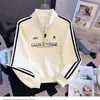 Sudadera de estilo americano con media cremallera y cuello alto para mujer, nuevo estilo Primavera y Otoño 2026, holgada y chic, reduce la edad y estiliza, top de manga larga a rayas