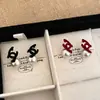 Pendientes de Perla Cruzados Dobles C Vintage Otoño e Invierno para Mujer 2024 Nuevos Pendientes Elegantes de Gama Alta Pendientes Únicos de Nicho