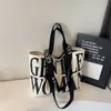 Bolso de Lona Informal Transfronterizo Nuevo para Mujer de Gran Capacidad Retro con Estampado de Letras Bolso Tote de Viaje con Correa para el Hombro Cruzado