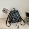 Mochila escolar de nicho estilo coreano Shuai Mi Jia para niñas, nueva bolsa de viaje informal de alta moda de lunares 2026, mochila elegante