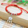 Puesto vendiendo joyería de Yiwu pulsera de cuerda colorida tejida a mano para el Festival del Bote del Dragón venta al por mayor bolsita dumplings cuerda de mano colorida
