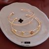 Pulsera Abierta de Doble Capa de Flor de Cuatro Hojas de Circonita Corea del Sur Ins Pulsera de Lujo Ligero Pulsera Versátil de Alta Gama Venta al por Mayor Mujeres