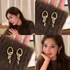 Aretes de Aro Huecos Dorados Cepillados con Diamantes Brillantes y Borlas, Aretes de Lujo de Alta Gama para Mujer con Temperamento Único