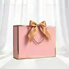 Empaque Lazo de Regalo Personalizado Bolsa de Papel de Mano Bolsa de Compras Lista para Usar Exportación Transfronteriza Impresión de Logotipo Fabricante Envío Gratis