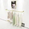 Estante de exhibición para tienda de ropa estante de hierro dorado para ropa de mujer ropa de niños colgante lateral de pared colgador de exhibición de pared