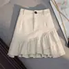 Falda corta de mezclilla blanca irregular con dobladillo de volantes para mujer, cintura alta, línea A, bodycon de verano, adelgazante 2026