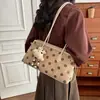 Bolso de lunares elegante transfronterizo de comercio exterior para mujer, nuevo, de alto valor, nicho, para ir al trabajo, bandolera, bolso de hombro versátil y moderno