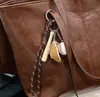 Bolso de mano grande de cuero encerado para mujer, nuevo bolso de hombro de moda 2025, bolso de mensajero elegante y versátil