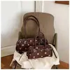 Bolsa de Ombro Transversal Retro Versátil Feminina 2026 Nova Tendência de Outono Bolsa de Ombro Único Simples Sensação de Alto Padrão Bolsa Transversal