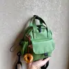 Mochila pequeña ligera y linda, versión de cuero impermeable, bolso de mano pequeño, mochila de moda impermeable versátil