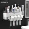 Suporte de escova de dentes para casal criativo Parede de sucção Multifuncional Lavagem Armazenamento Caixa Escova de dentes Copo Rack de armazenamento Tubo de escova de dentes