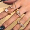 Anel Brilhante Japonês e Coreano Aberto Estrela de Cinco Pontas Gotejamento de Óleo Diamante Amor Pérola Anel de 4 Peças Feminino Atacado