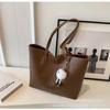 Bolso de gran capacidad para mujer, nuevo bolso de hombro sencillo de moda otoño-invierno 2023, bolso de mano informal con textura para el trabajo y los desplazamientos diarios.