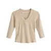 Ins moda feminina atacado estilo europeu e americano cruzado garota popular petite gola V ombro direito retalhos manga curta média slim fit camiseta
