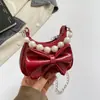 Nudo de lazo elegante 2026 gran capacidad moda nuevo moderno chica popular cadena bandolera perla bolso de mano bolso de hombro