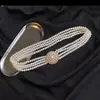Cinturón decorativo para mujer versión coreana de Joker cadena de cintura de perlas con diamantes de imitación cadena de cintura elástica de verano para mujer venta al por mayor directa de fábrica