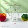 Taza medidora de plástico con tapa y escala en stock, especializada para tiendas de té de burbujas, jarra medidora doméstica de grado alimenticio, resistente a altas temperaturas