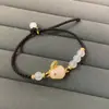 Pulsera de conejo de jade Hetian natural cuerda de mano tejida de ágata blanca diseño de nicho estilo chino cuerda roja para año de nacimiento