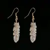 Venta directa de fábrica aretes largos de hoja dorada aretes joyería de mujer nueva y popular E227