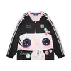 Camiseta de manga larga con cuello en V y estampado de muñeco de dibujos animados estilo americano para mujer, nueva colección otoño 2026, top de punto suelto, casual y versátil