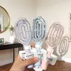 Mini peine de costillas portátil con diseño hueco para volumen alto en la coronilla, cojín de masaje, adecuado para estudiantes, hombres y mujeres, peine pequeño portátil