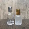 En stock B115-30ml50ml100ml botella de perfume de vidrio transparente, botella de recarga cosmética/botella vacía con spray de presión