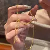 Colar de Borla Estrela de Quatro Pontas Banhado a Ouro Prateado Luxo Leve Nicho Versátil Moda High-End Corrente para Clavícula Fabricante