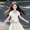 Conjunto de Dos Piezas Falda de Longitud Media con Solapa Rayada 2026 para Niños Mayores, Nueva Falda Elegante con Lazo, Dulce Atuendo de Verano