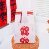 Bolsa de Tricô Ano Novo 2026 Novo Estilo Bolsa de Presente para Mulheres Bolsa de Mão Ano do Cavalo Embalagem de Presente Reunião Anual da Empresa Vermelho Celebração