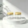 En stock: Botellas transparentes de boca ancha de 56 dientes/68 dientes/89 dientes, tarro de crema de 250 g con tapa transparente de borde dorado, material de embalaje para mascarilla capilar de 500 g