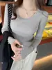 Suéter gris de cuello redondo bajo para mujer, capa base, ropa interior, nuevo estilo otoño e invierno, top de punto de manga larga ajustado
