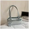 Bolsa de Ombro/Axila Fashion Tendência Design Nicho Novo Couro Decorado com Cinto Bolsa Transversal Personalidade Doce e Cool Primavera 2026
