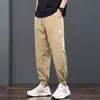 Pantalones casuales para hombre 2026 verano estilo fino juvenil holgados tipo harén con cintura elástica y tobillos fruncidos, pantalones de trabajo cropped