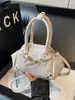 Bolso de Mano Cuadrado Pequeño Simple Estilo Coreano Transfronterizo para Mujer Nuevo Modelo 2026 Bolso de Hombro Cruzado de Moda de Alta Calidad
