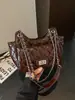 Bolso de hombro moderno y a la moda para mujer 2026 nuevo verano nicho simple de alta gama versátil casual para el día a día bandolera
