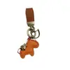 Venta directa de fábrica inmediatamente rico colgante llavero personalidad creativa colgante de cuero llavero para bolso de pareja