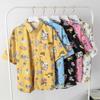 Camisa hawaiana de manga corta con estampado floral, estilo japonés, retro, con grafiti de dibujos animados, para hombre, holgada, para pareja, estudiante, moderna.