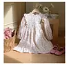 Ropa infantil estilo coreano con cuello alto y ribete de volantes, vestido para niñas, colección primavera 2026, vestido de princesa floral de manga larga para bebés y niños pequeños