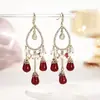 Pendientes exóticos con borlas de cristal, elegantes tachuelas de circonita en forma de gota de agua, pendientes versátiles de lujo ligero hechos a mano de nicho
