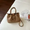 Bolso de cubo de mano de nicho, nuevo modelo de verano 2026, simple, elegante, moderno, bolso de hombro cruzado, bolso de mano casual