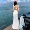 Vestido Branco Longo Renda Floral Vazado Picante Estilo Francês para Mulheres, Novo Verão Sexy Costas Abertas Cintura Marcada